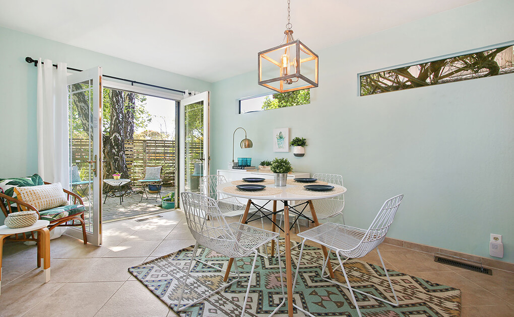 Quaint dining room into small back patio